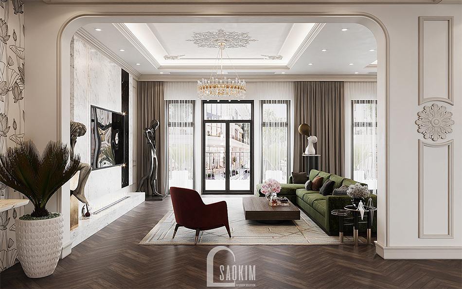 Thiết kế nội thất phòng khách nhà liền kề Louis City Hoàng Mai theo phong cách Tân Cổ Điển với gam màu trắng làm chủ đạo và điểm nhấn màu xanh rêu